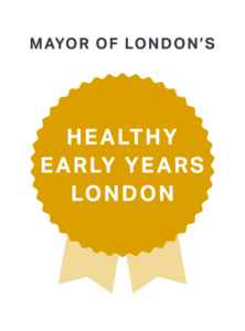 A gold rosette representing the Healthy Early Years London Gold award 