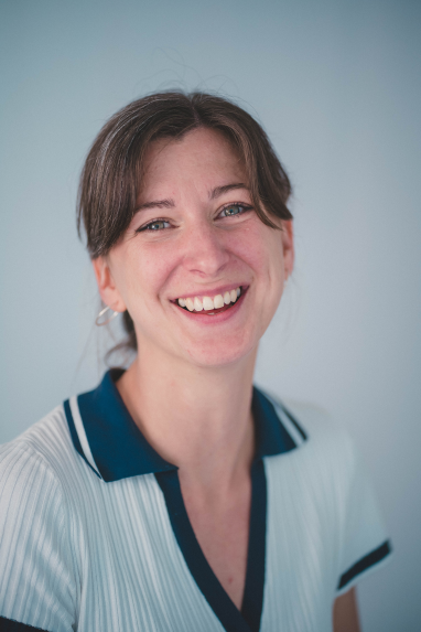 Woman smiling while posing for camera