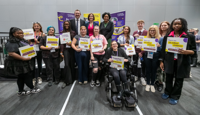 A group of young people with politicians at the Labour Party Conference 