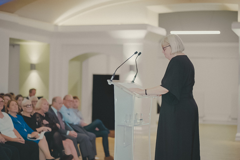 Dame Christine Lenehan speaking in front of an audience