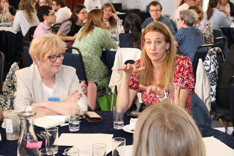Susie Owen, DfE Director of Early Years, discussing a shared vision for early years with other attendees at a table at the NCB Summit  