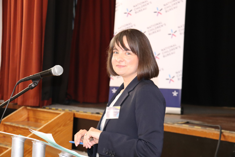 Alice Jones Bartoli smiling at the camera as she prepares to present at the NCB Summit