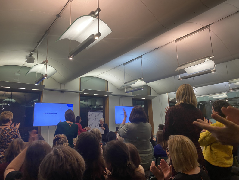 Audience members giving Philippa Stobbs a standing ovation