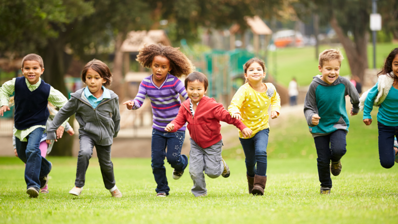 Young children running towards the camera. 